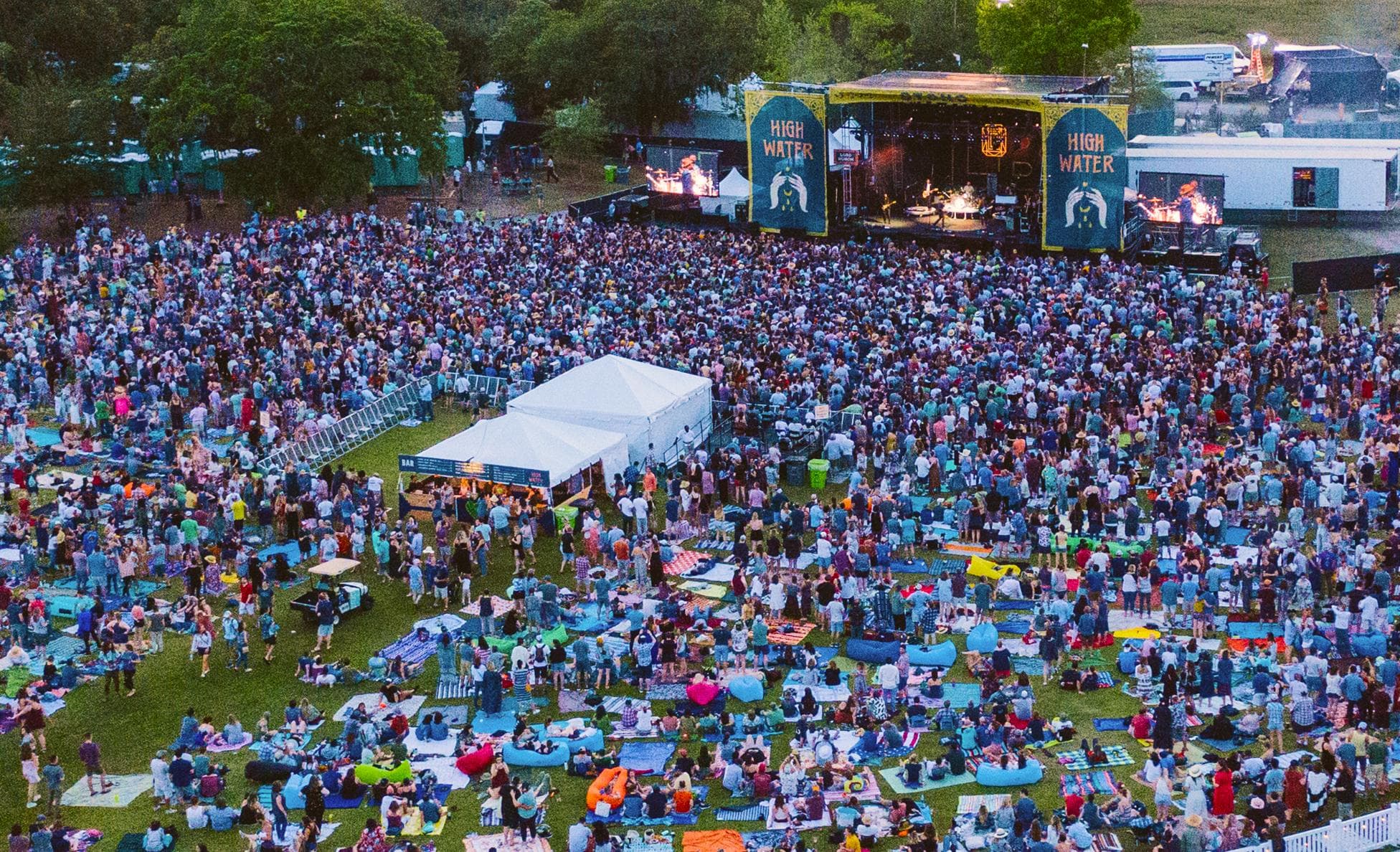 Aerial dusk view of the crowd facing the Stono Stage at High Water Festival