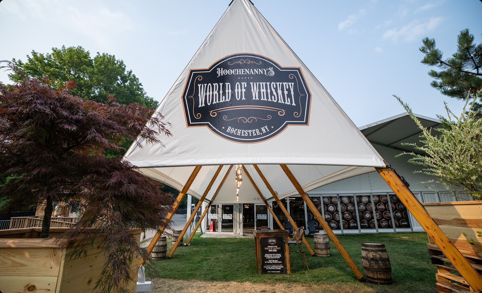 Guests sampling spirits in the World of Whiskey tent at Hoochenanny Festival