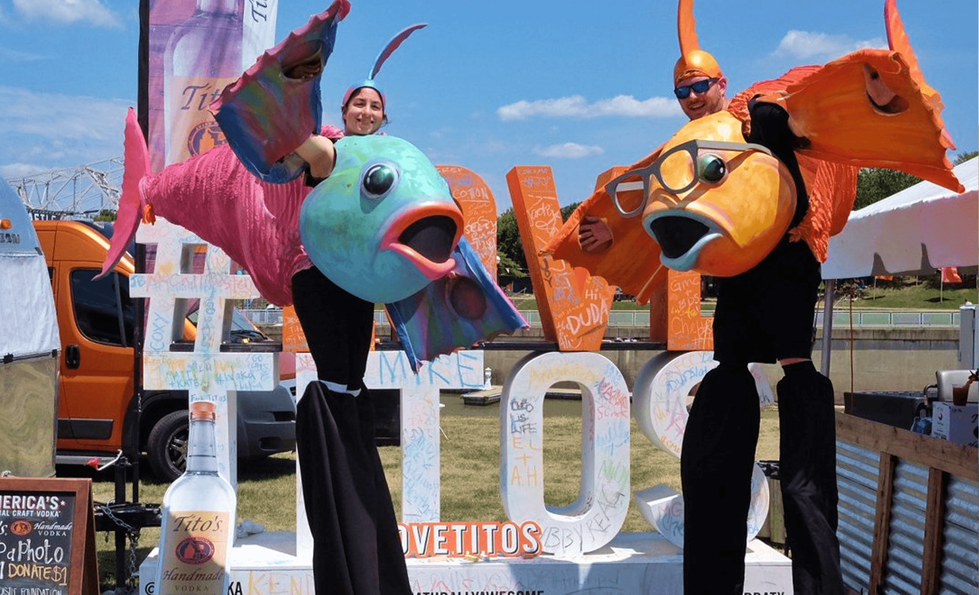 Stilt-walking performers at the #LoveTitos activation at Forecastle Festival